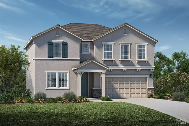 a front view of a house with a yard and plants