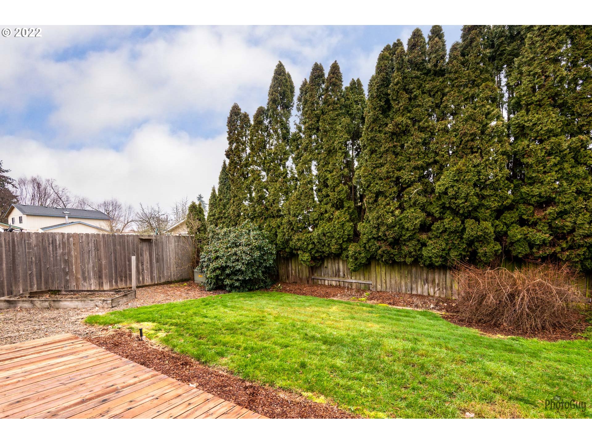 4865 Beaver Street Springfield, OR 97478 - Photo 27 of 31 a view of a yard with wooden fence