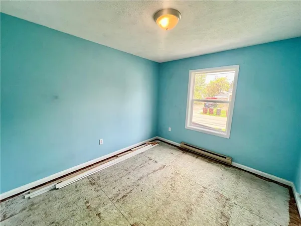 an empty room with a empty space and a window