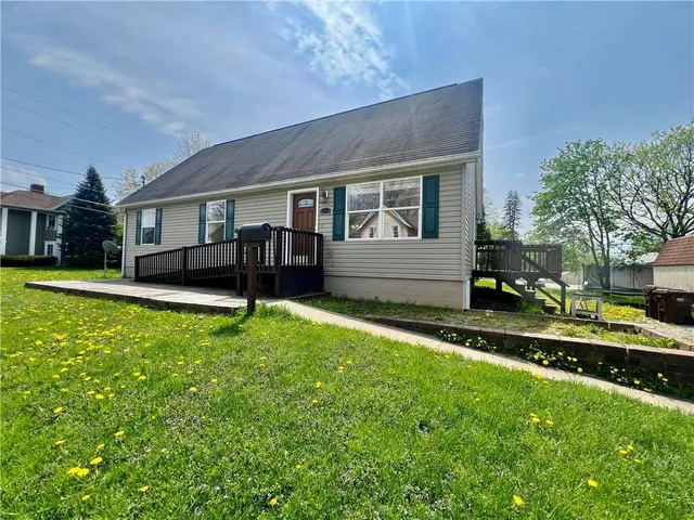 front view of a house with a yard