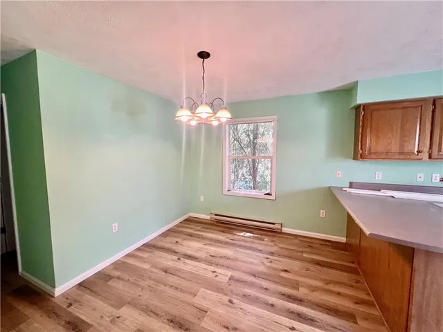 a room with cabinets and wooden floor