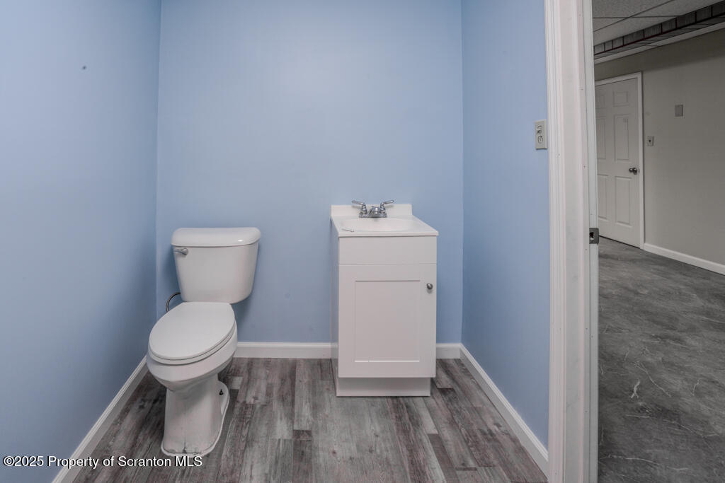 717 Beech Street Old Forge, PA 18518 - Photo 23 of 27 a bathroom with a toilet and a sink