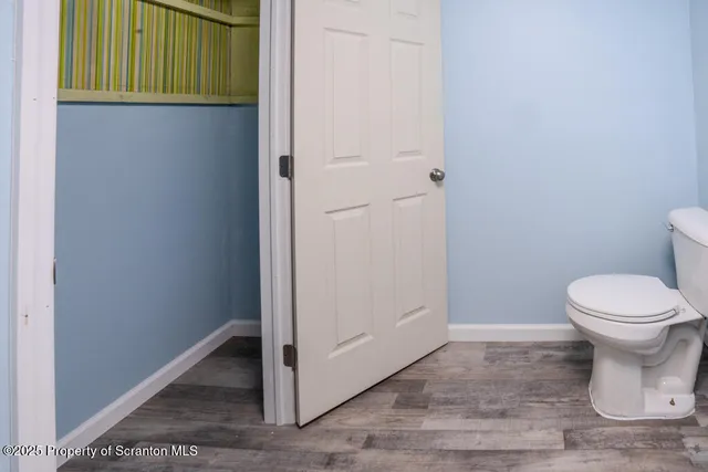 a view of a bathroom with a toilet