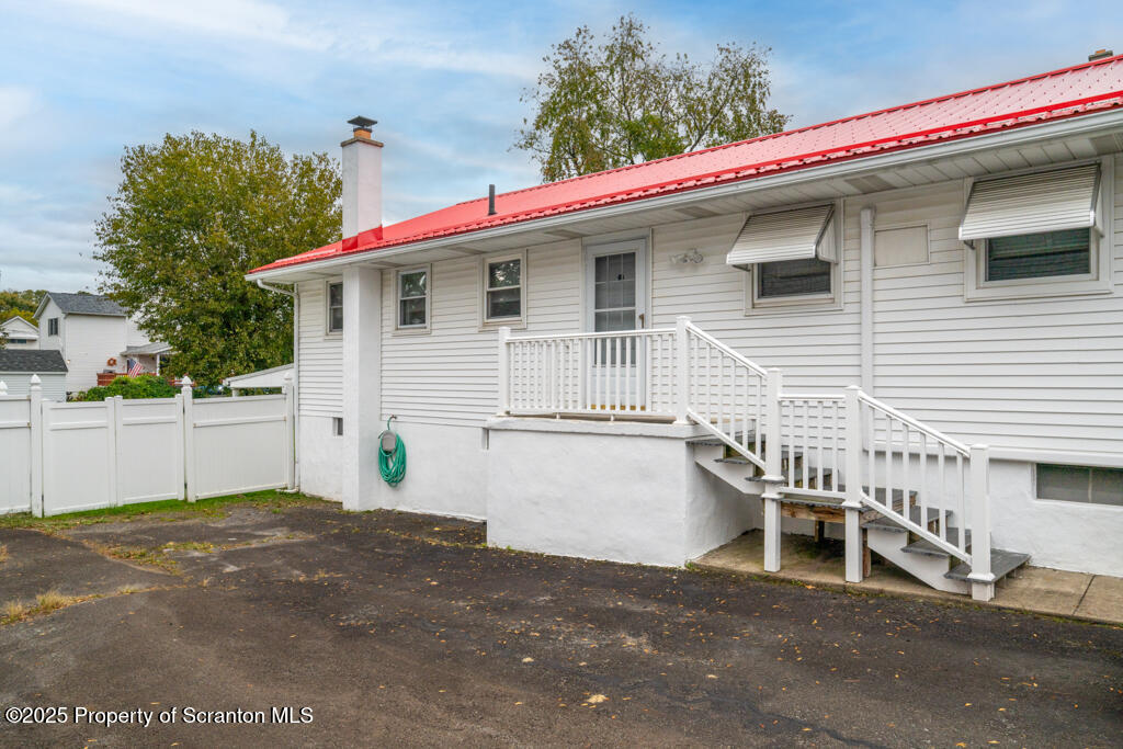 717 Beech Street Old Forge, PA 18518 - Photo 3 of 27 a view of a white house with a white roof