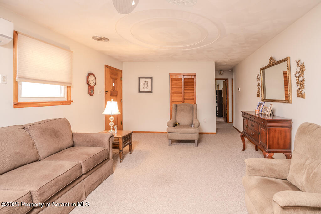717 Beech Street Old Forge, PA 18518 - Photo 6 of 27 a living room with furniture and a flat screen tv