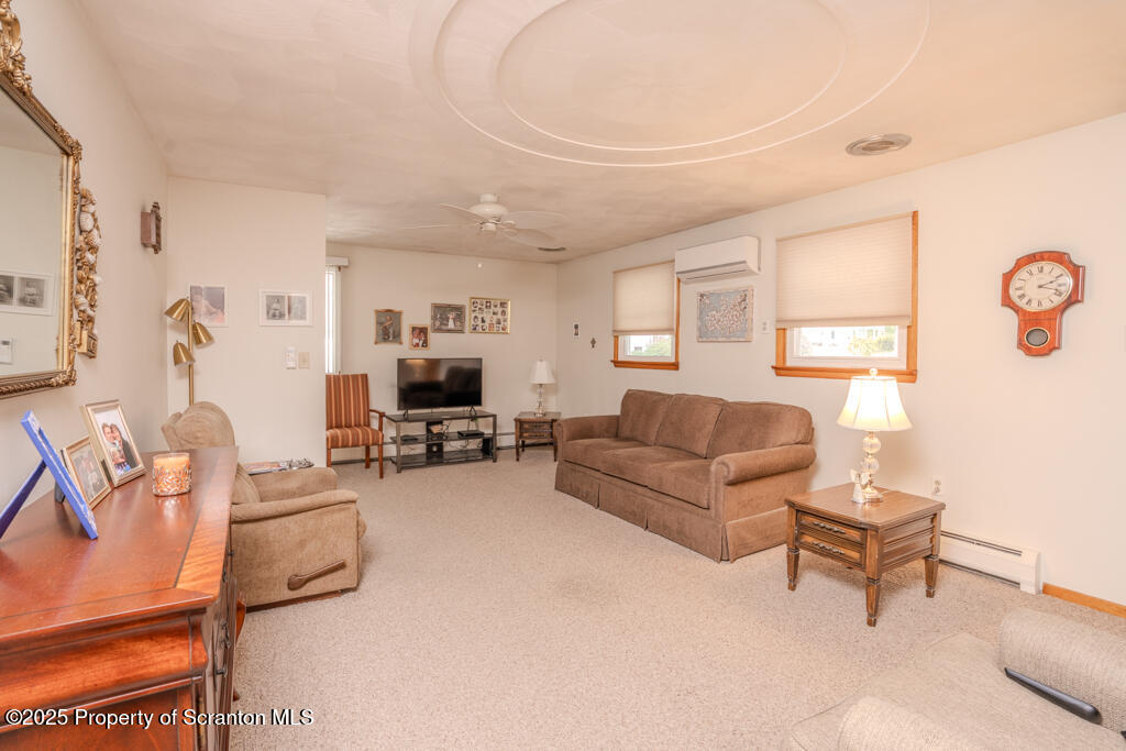 717 Beech Street Old Forge, PA 18518 - Photo 8 of 27 a living room with furniture and a flat screen tv