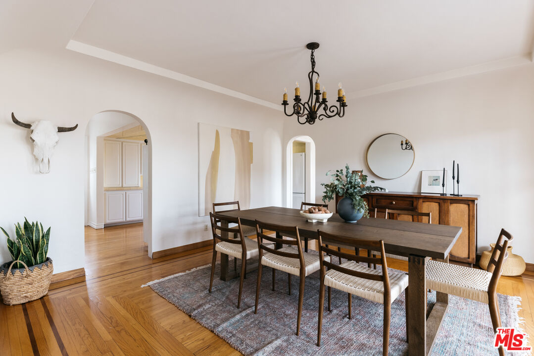 3681 Fairland Boulevard View Park, CA 90043 - Photo 16 of 54 a view of a dining room with furniture and wooden floor
