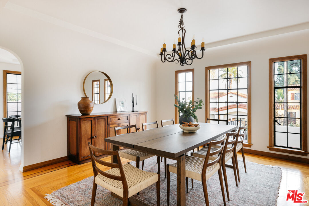 3681 Fairland Boulevard View Park, CA 90043 - Photo 17 of 54 a view of a dining room with furniture window and wooden floor