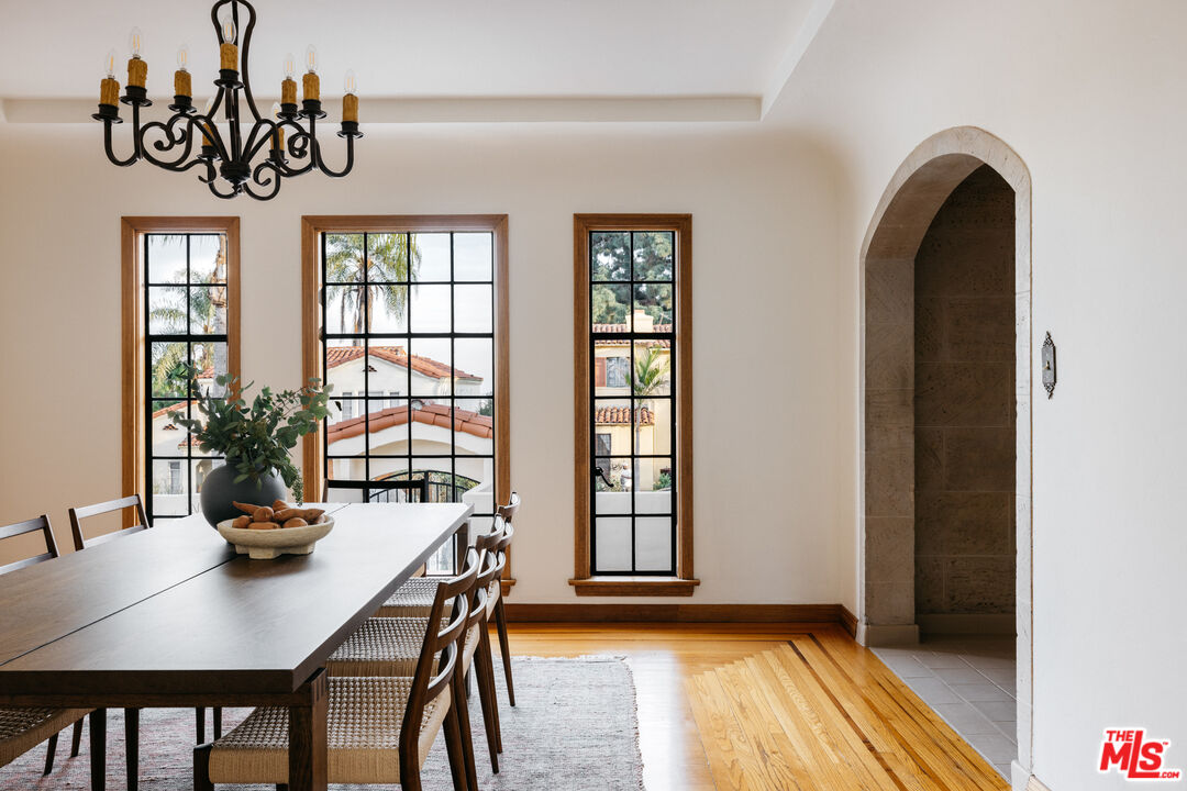 3681 Fairland Boulevard View Park, CA 90043 - Photo 18 of 54 a view of a dining room with furniture window and wooden floor