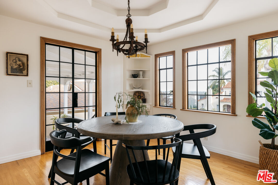 3681 Fairland Boulevard View Park, CA 90043 - Photo 20 of 54 a view of a dining room with furniture window and wooden floor