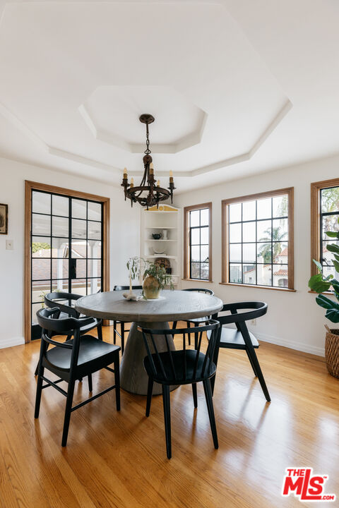 3681 Fairland Boulevard View Park, CA 90043 - Photo 21 of 54 a view of a dining room with furniture window and wooden floor