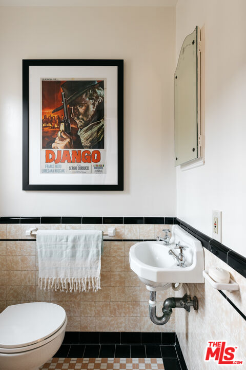 3681 Fairland Boulevard View Park, CA 90043 - Photo 23 of 54 a bathroom with a sink and a toilet