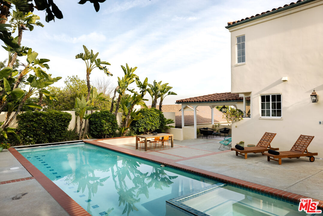 3681 Fairland Boulevard View Park, CA 90043 - Photo 49 of 54 a view of a swimming pool with chairs