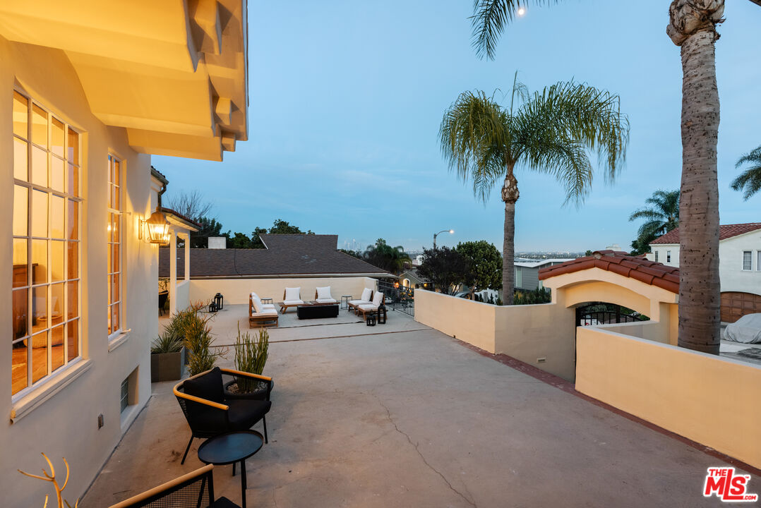 3681 Fairland Boulevard View Park, CA 90043 - Photo 54 of 54 a swimming pool with outdoor seating and a potted plant