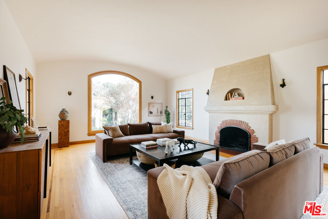 3681 Fairland Boulevard View Park, CA 90043 - Photo 7 of 54 a living room with furniture fireplace and window