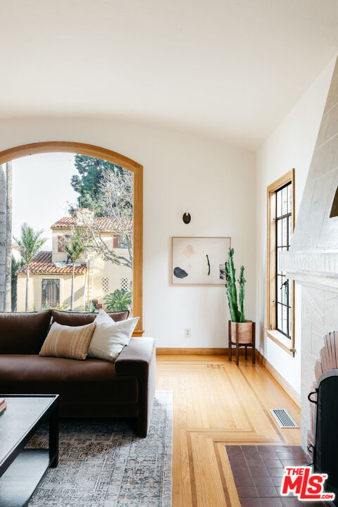 3681 Fairland Boulevard View Park, CA 90043 - Photo 10 of 54 a living room with furniture and a large window