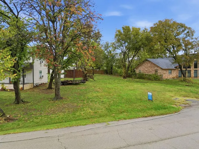 a garden with trees in the background