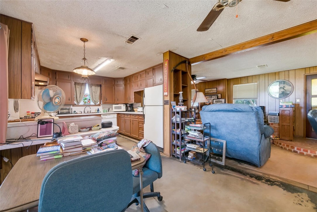901 South Old Robinson Road Robinson, TX 76706 - Photo 12 of 55 a living room with furniture and kitchen view