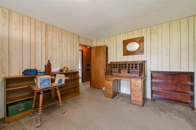 a view of room with furniture and a window