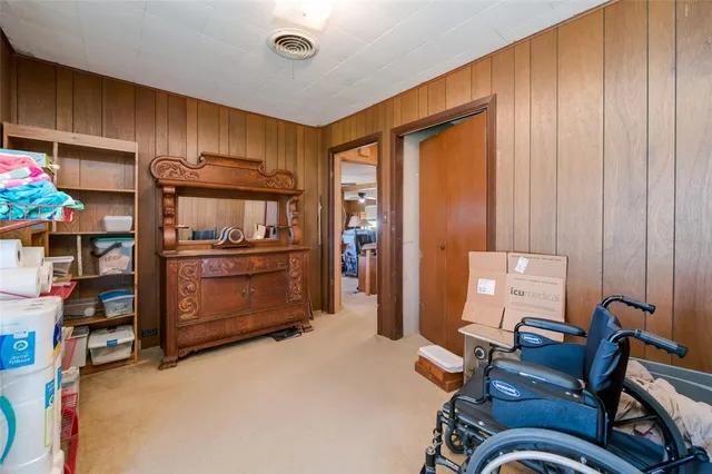 a room with furniture closet and a large window
