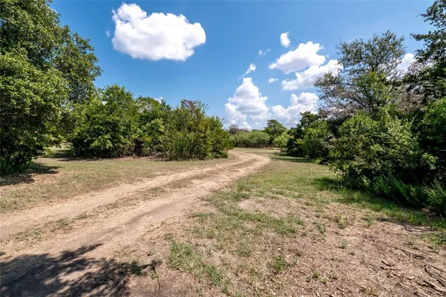 a view of a golf course with a lake