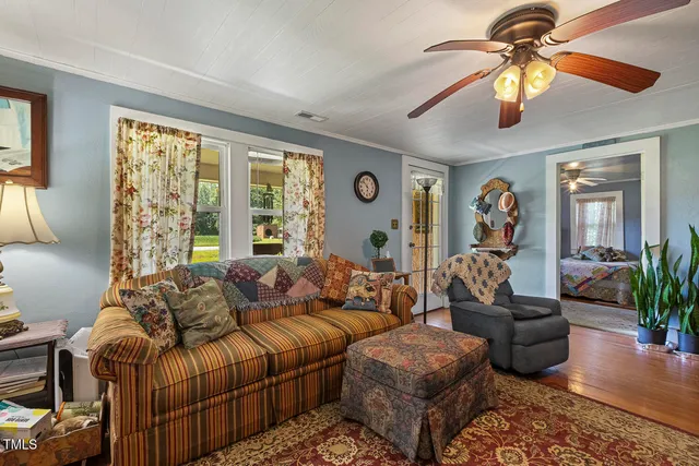 a living room with furniture fireplace and window