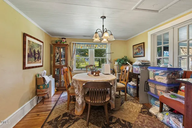 a bathroom with a sink mirror and shower