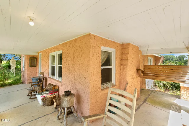 a front view of a house with yard and green space