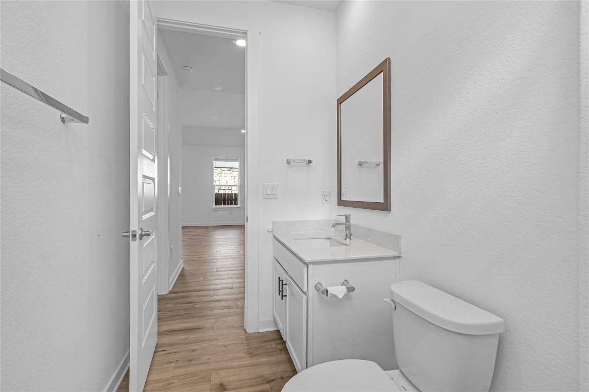 1925 Ruger Pass Leander, TX 78641 - Photo 12 of 26 a bathroom with a toilet sink and mirror