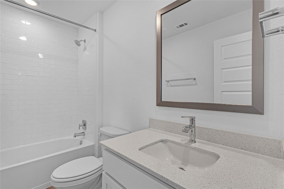 1925 Ruger Pass Leander, TX 78641 - Photo 21 of 26 a bathroom with a sink toilet tub and shower