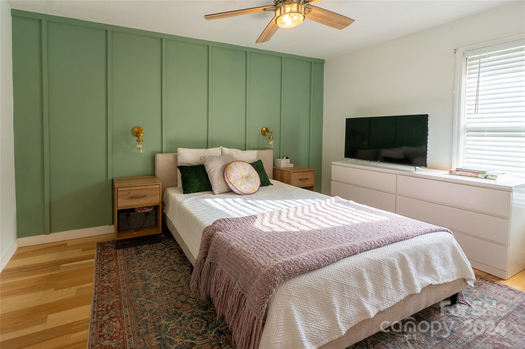 21625 Rio Oro Drive Cornelius, NC 28031 - Photo 14 of 31 a bedroom with a bed and a flat screen tv