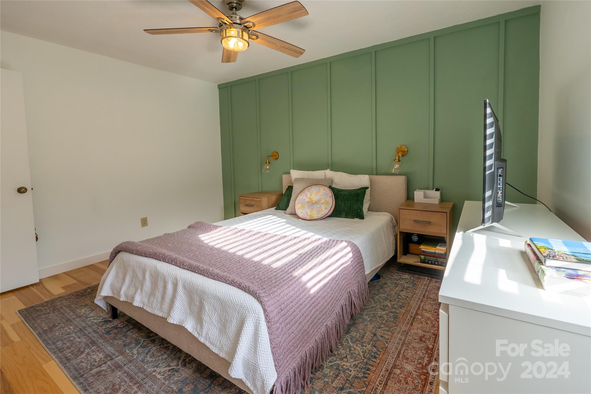 21625 Rio Oro Drive Cornelius, NC 28031 - Photo 15 of 31 a bedroom with a bed and ceiling fan