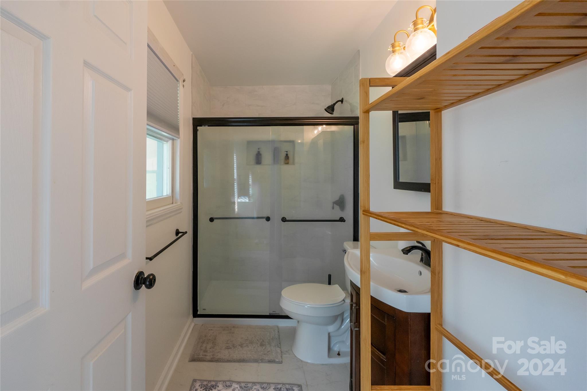 21625 Rio Oro Drive Cornelius, NC 28031 - Photo 16 of 31 a bathroom with a toilet and a shower