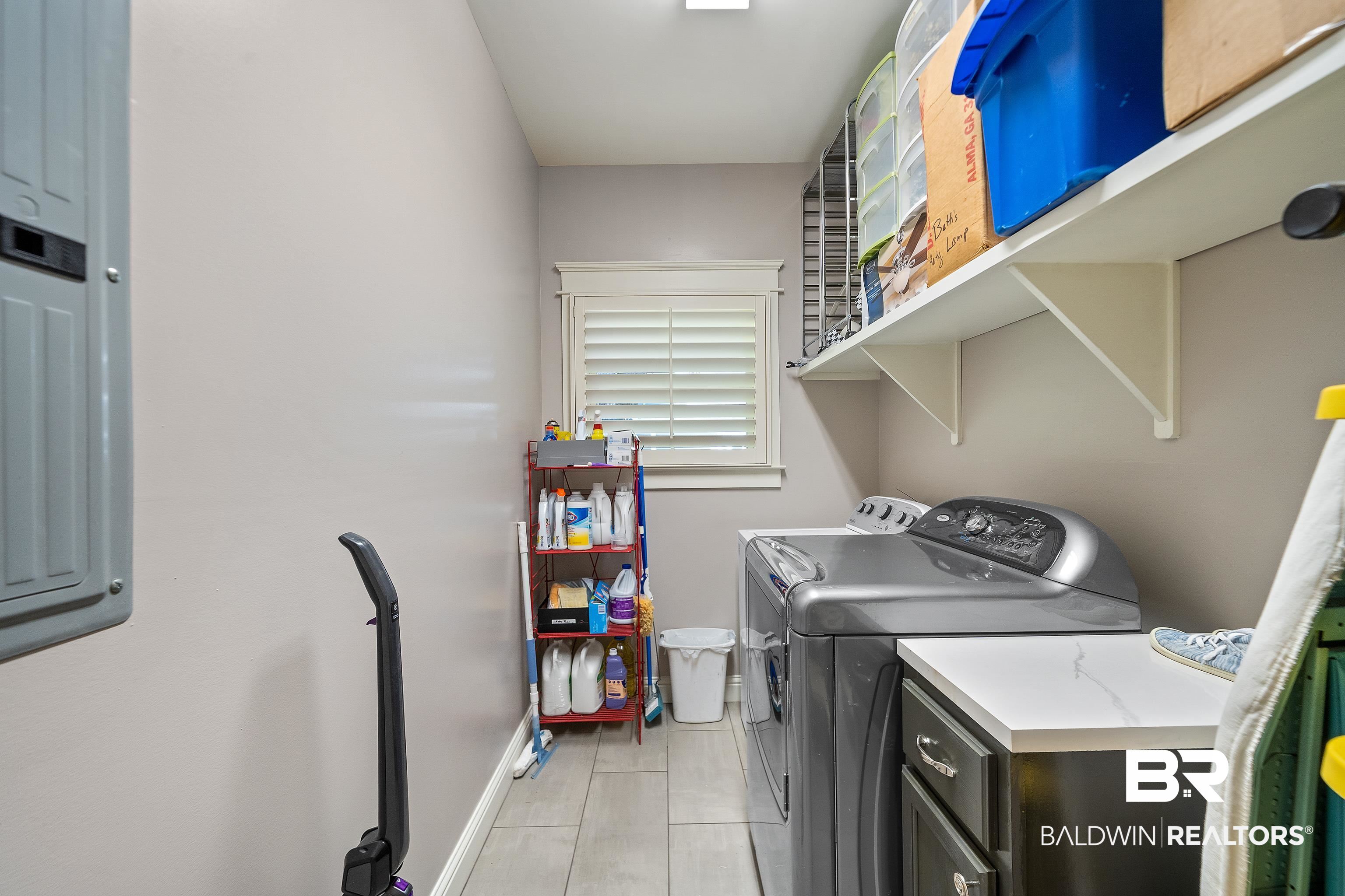29530 St John Street Daphne, AL 36526 - Photo 22 of 38 Clothes washing area with light tile patterned floors and washer and clothes dryer