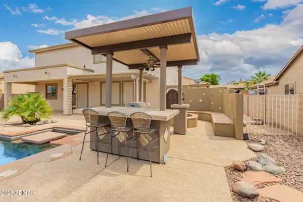 a view of swimming pool with outdoor seating