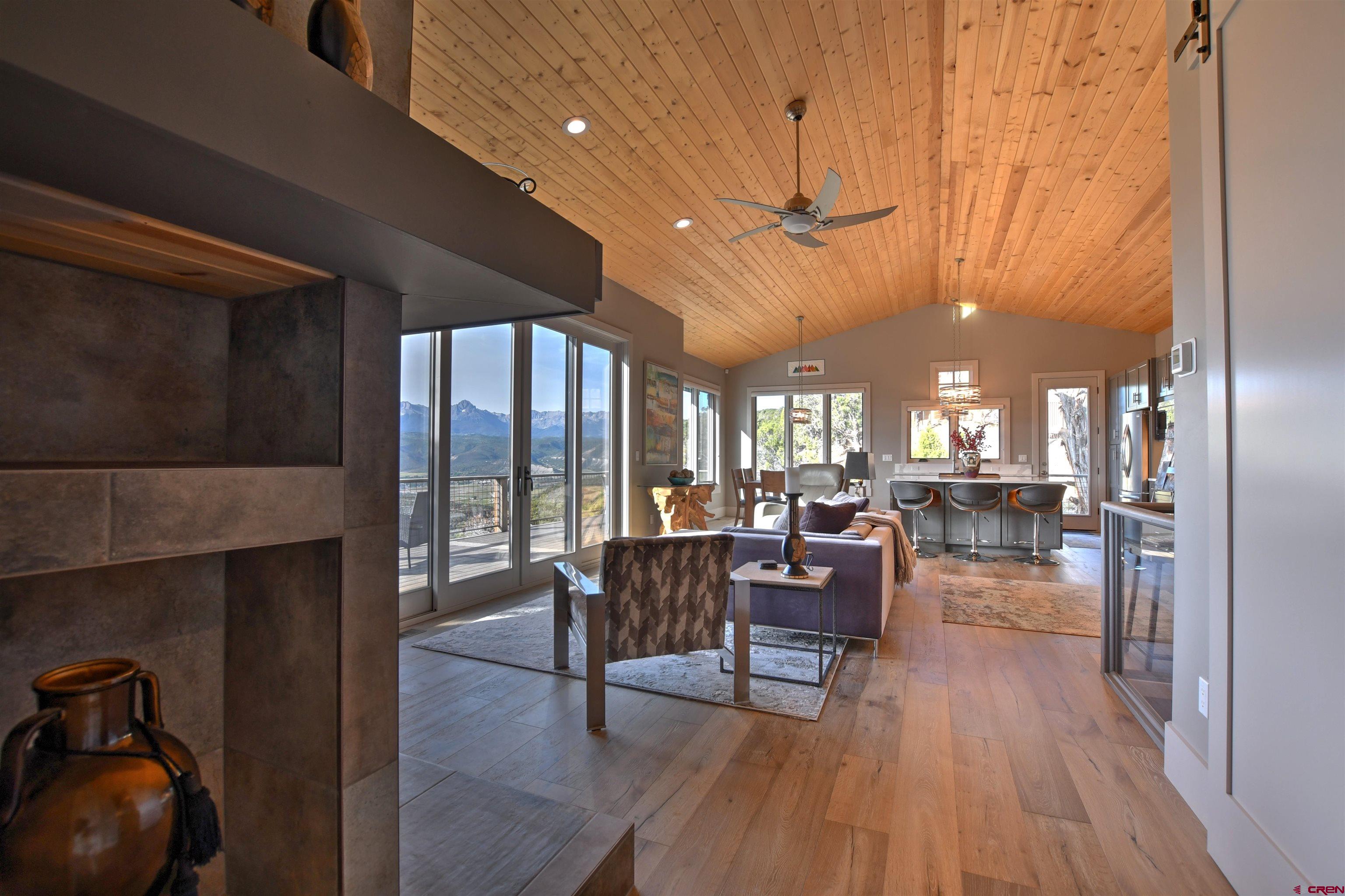 150 Enclave Road Ridgway, CO 81432 - Photo 11 of 45 a view of a dining room with furniture window and wooden floor