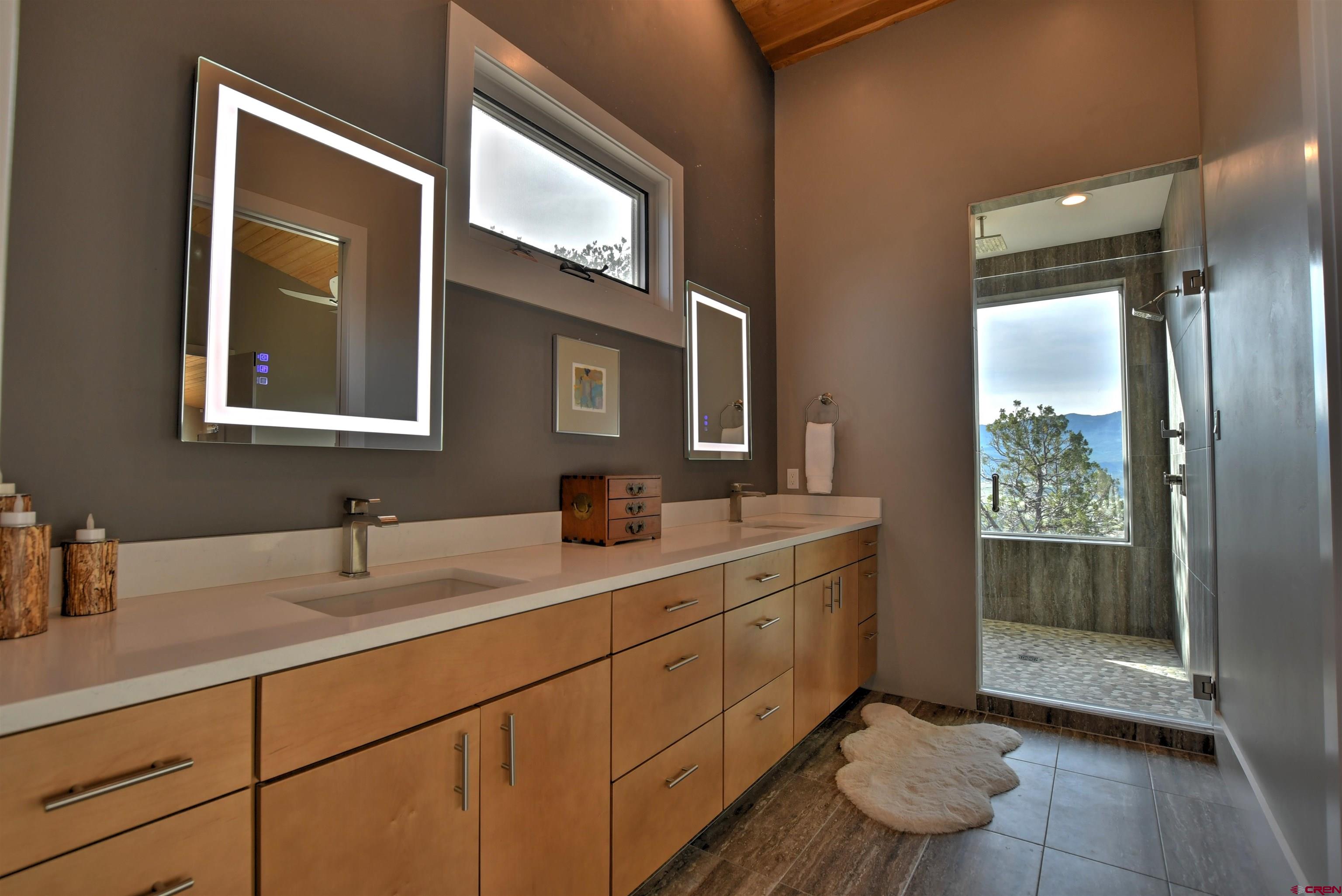 150 Enclave Road Ridgway, CO 81432 - Photo 14 of 45 a bathroom with a sink and a mirror