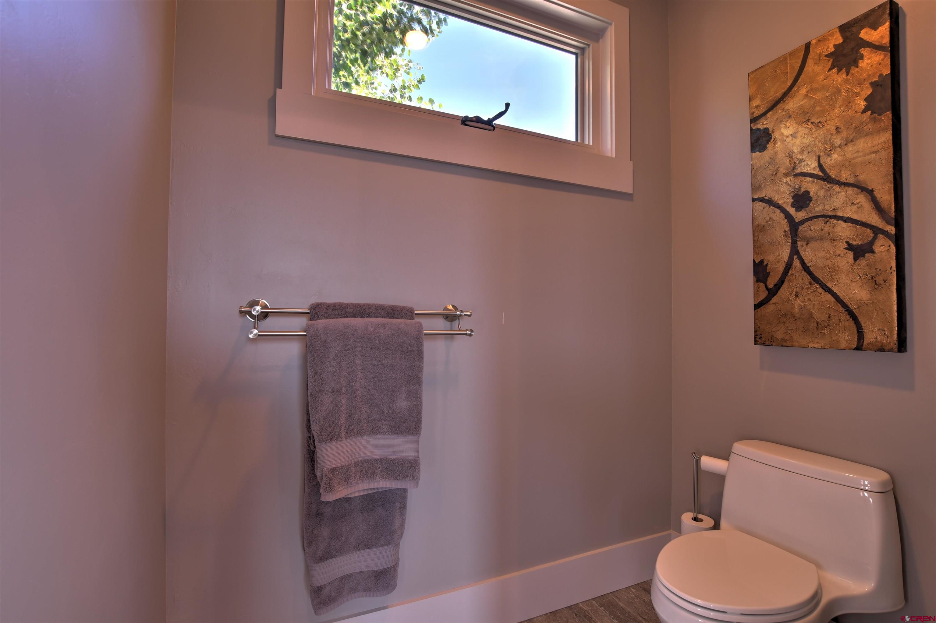 150 Enclave Road Ridgway, CO 81432 - Photo 17 of 45 a white toilet sitting next to a shower