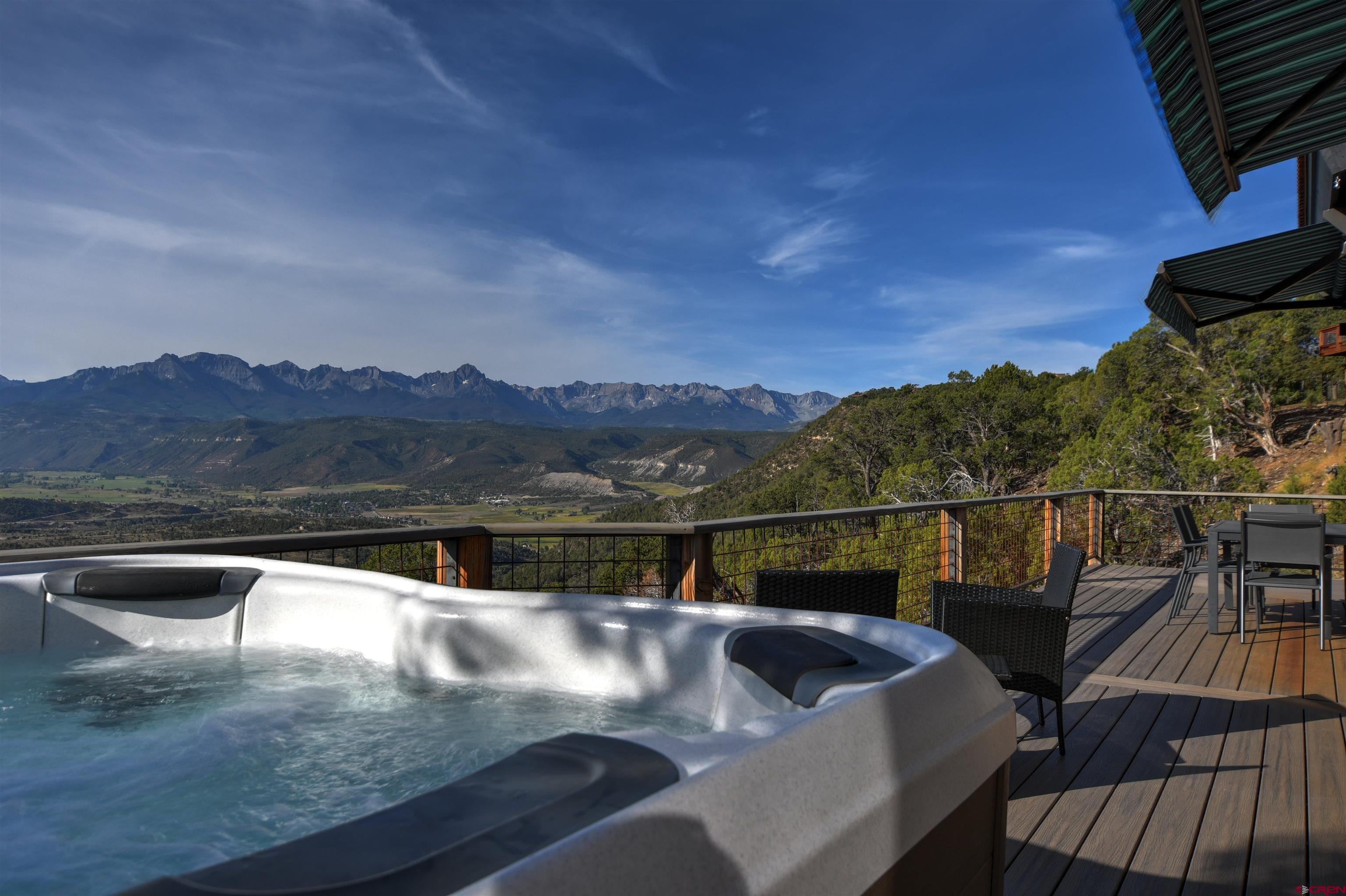150 Enclave Road Ridgway, CO 81432 - Photo 19 of 45 a view of swimming pool with mountain view and wooden floor