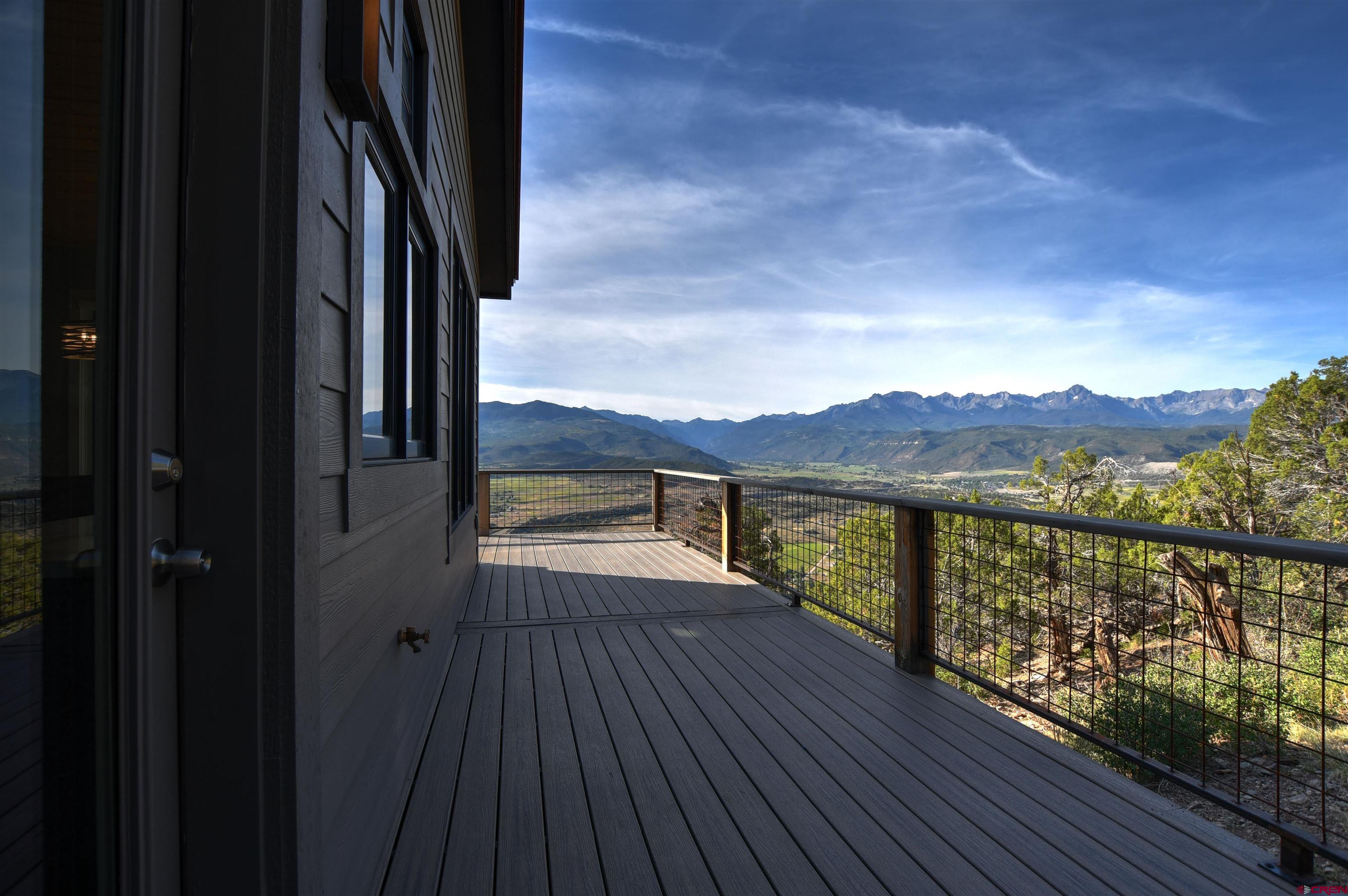 150 Enclave Road Ridgway, CO 81432 - Photo 23 of 45 a view of balcony with wooden floor and lake view