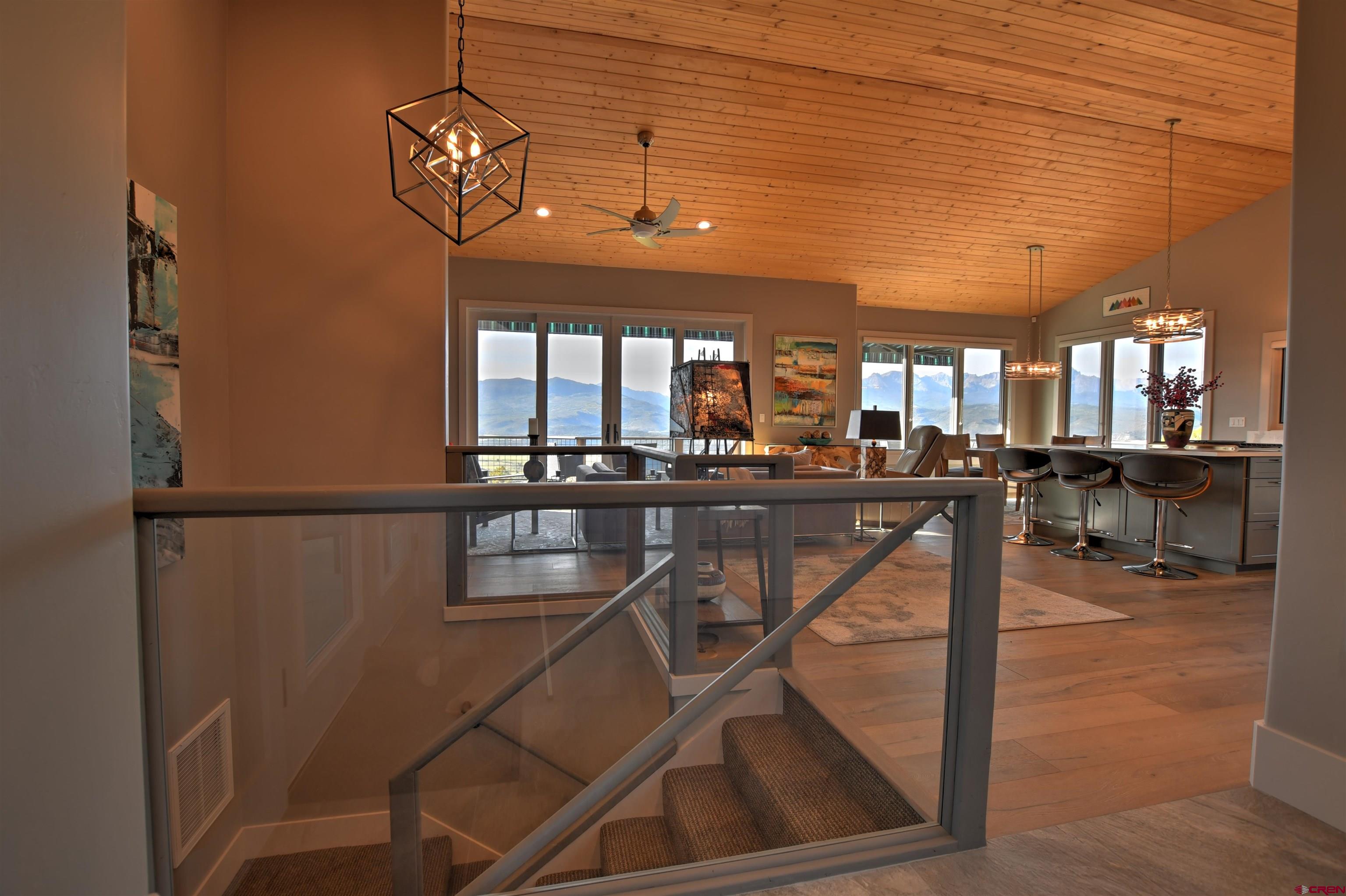 150 Enclave Road Ridgway, CO 81432 - Photo 39 of 45 a dining room with furniture and a floor to ceiling window
