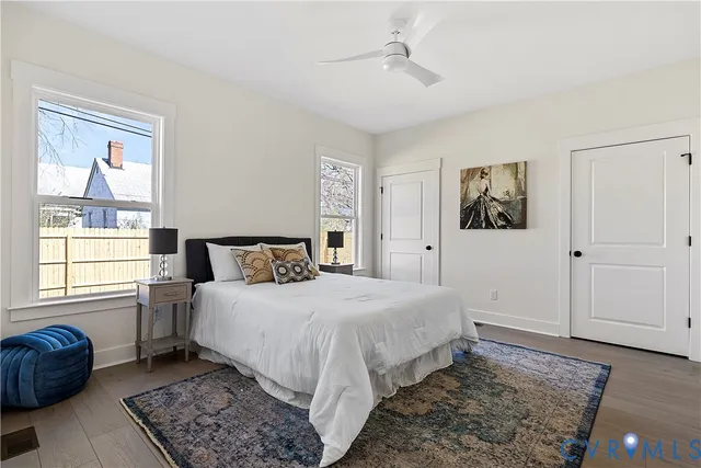 a bedroom with a large bed and a window