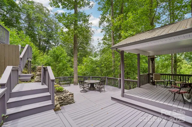 a view of a patio with two chairs and a table
