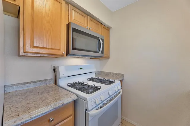a kitchen with a stove and a microwave