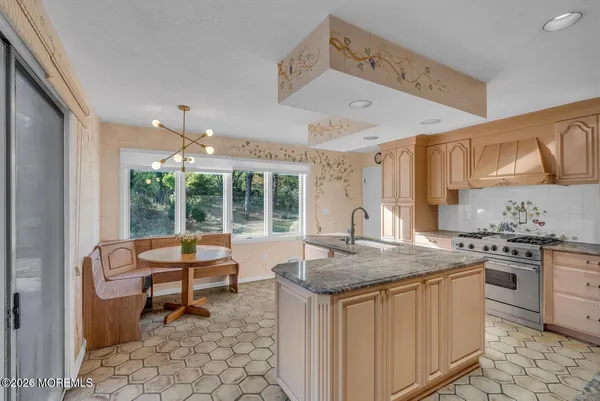 a bathroom with a double vanity sink mirror and toilet