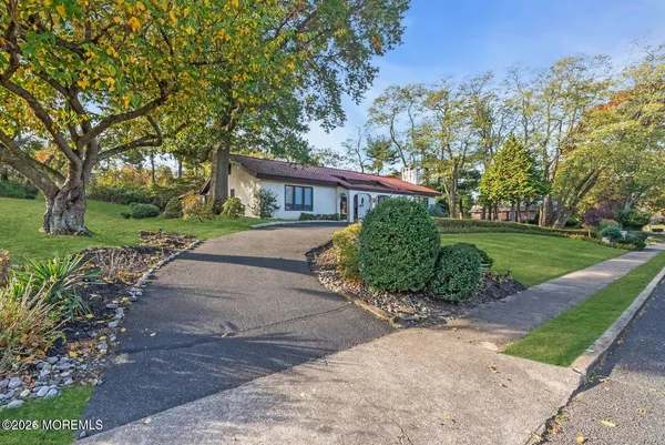 a view of a swimming pool with a yard