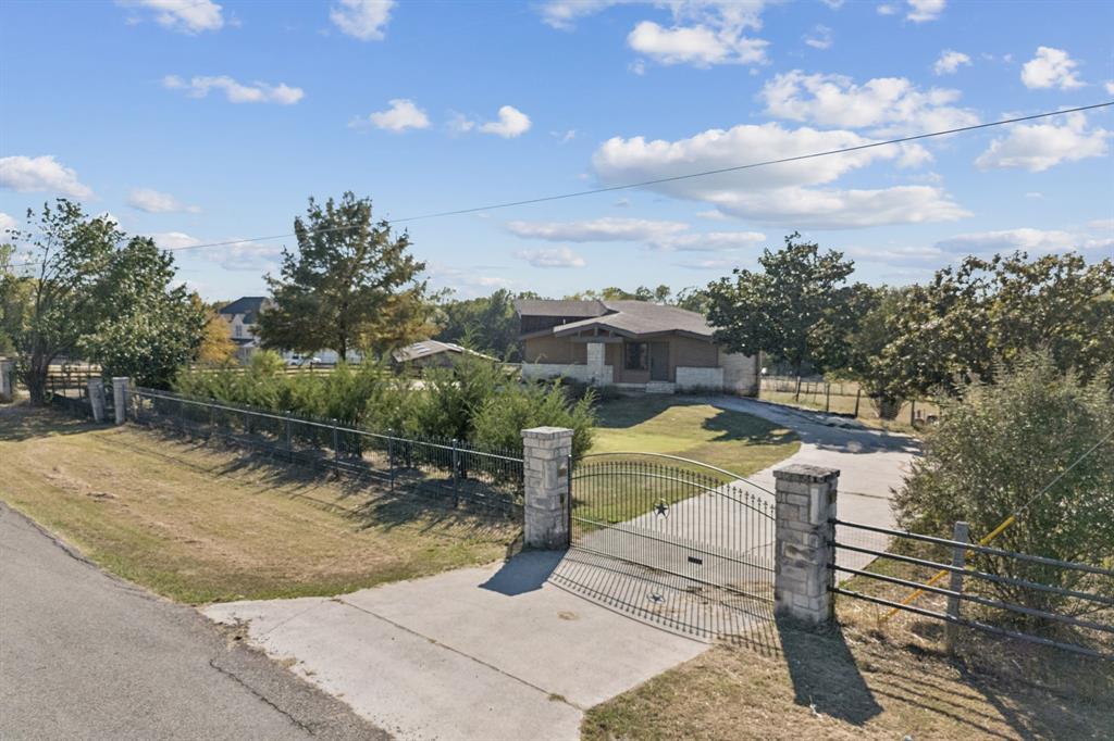 600 Long Road Lucas, TX 75002 - Photo 7 of 16 a view of a swimming pool with a patio and a yard