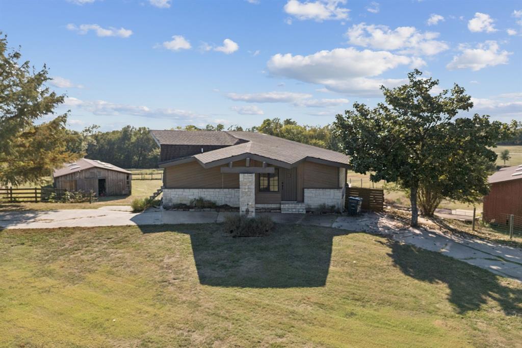 600 Long Road Lucas, TX 75002 - Photo 9 of 16 a view of a house with a yard covered in snow