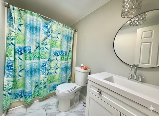 a bathroom with a toilet and a sink