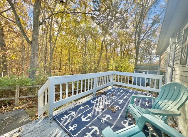 a view of a chair and table on the wooden floor